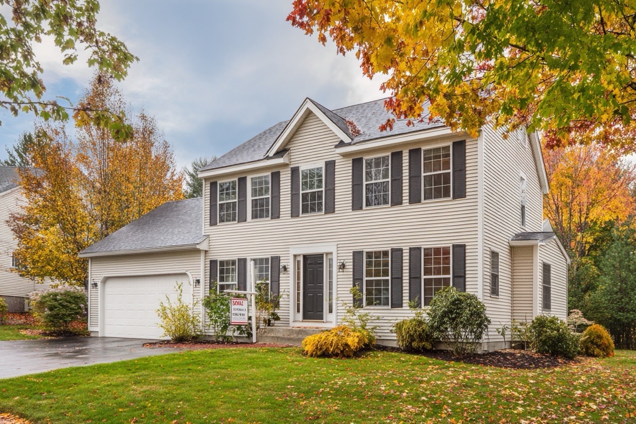 for sale by owner sign in front of new hampshire residential property