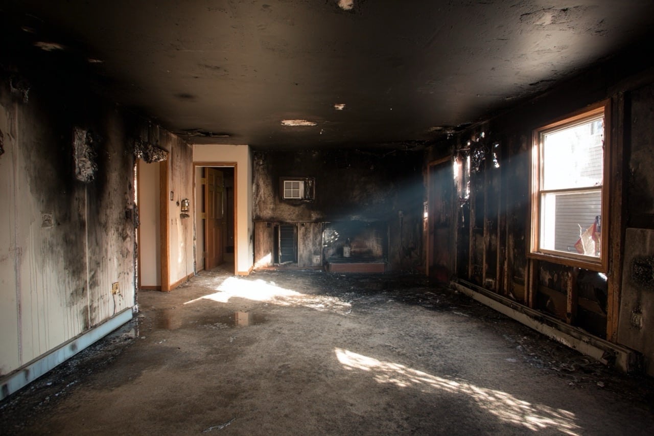 Smoke damaged interior of New Hampshire home showing structural concerns